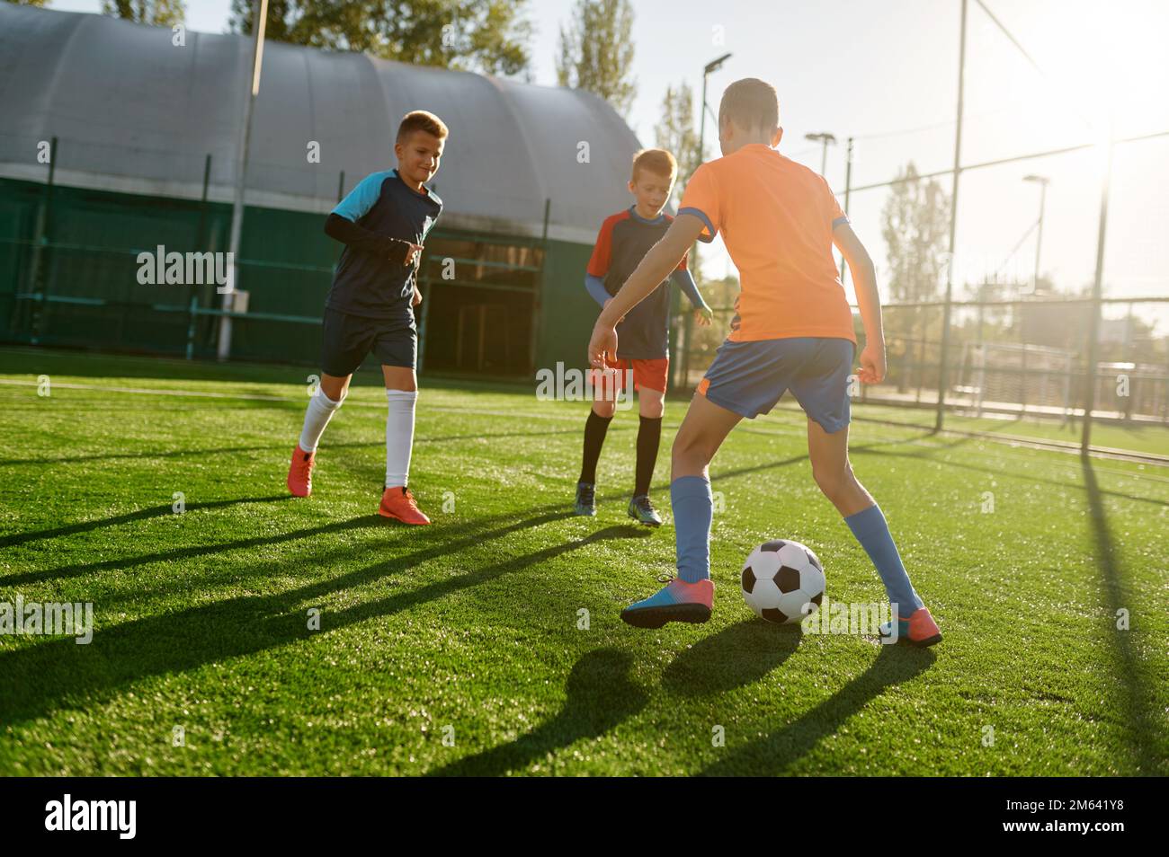 Young boys in sports soccer club on training unit improving skills Stock Photo