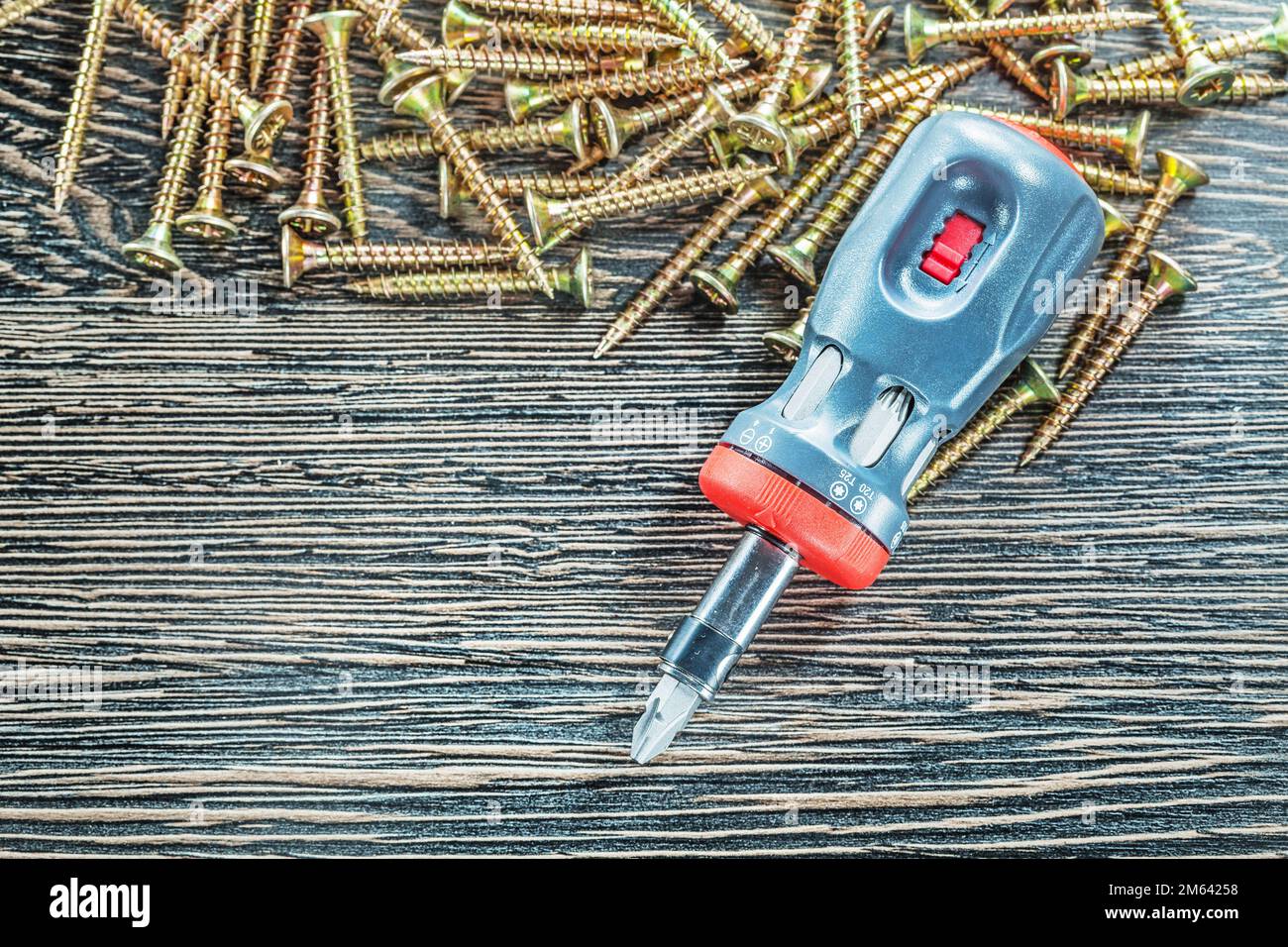Copper tapping screws screwdriver top view. Stock Photo