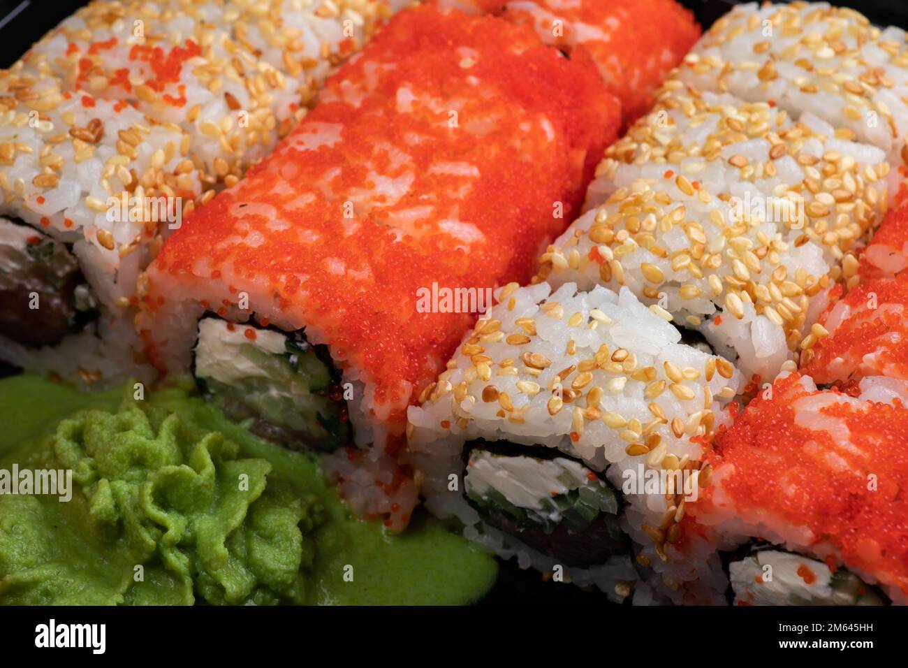 Japanese sushi food. Maki ands rolls with tuna, salmon, shrimp, crab and avocado. Top view of
