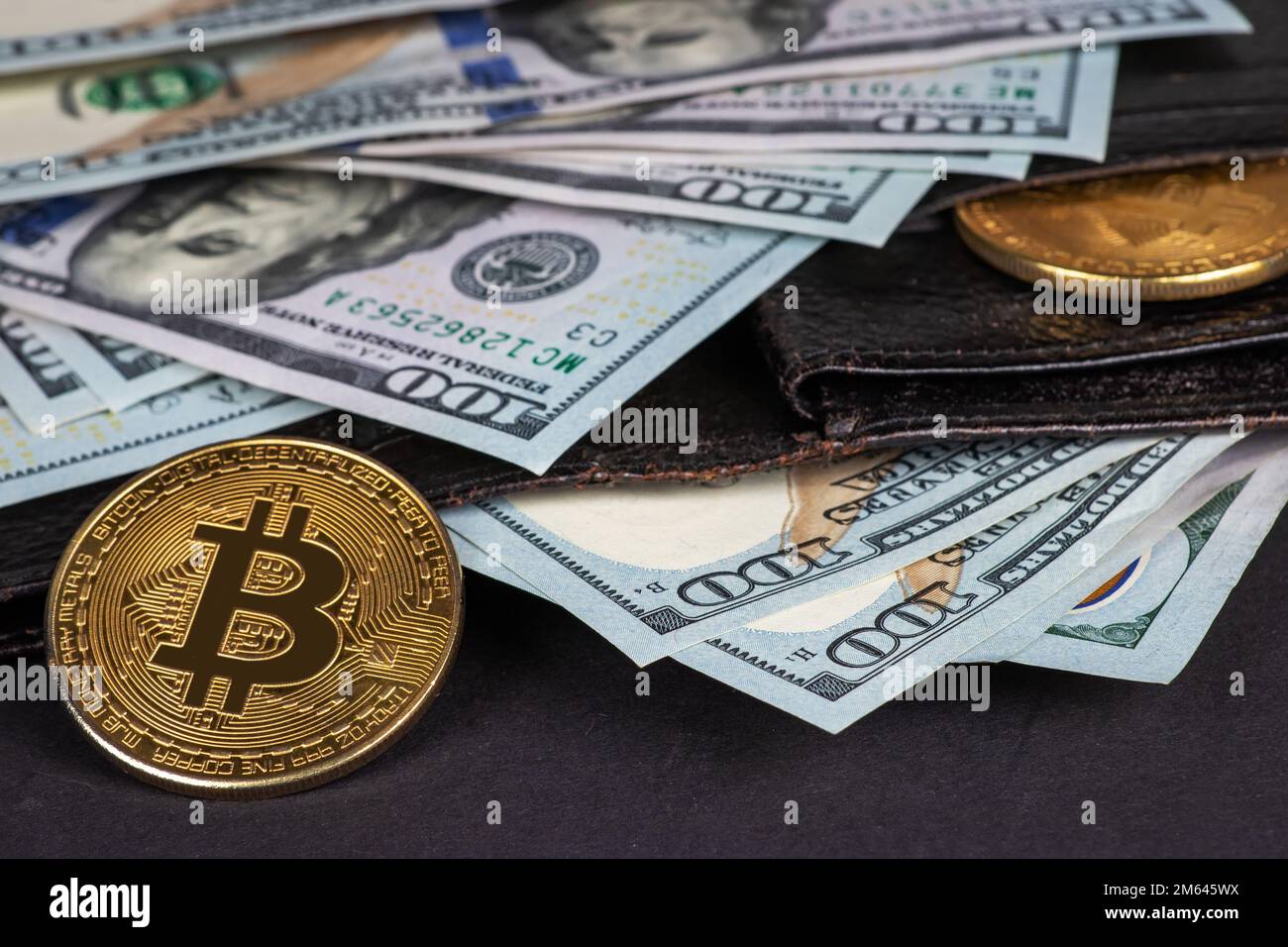 Golden bitcoins and hundred dollar bills in leather wallet. Bitcoin with  dollar in purse. Profit from mining crypto currencies. Miner with dollars  and Stock Photo - Alamy