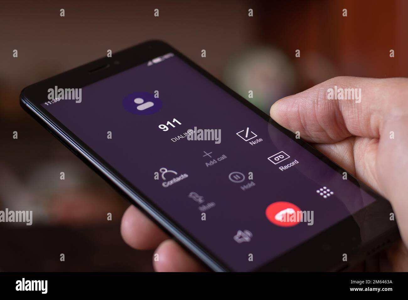 Dialing 911, call 911. Emergency concept man using a digital phone