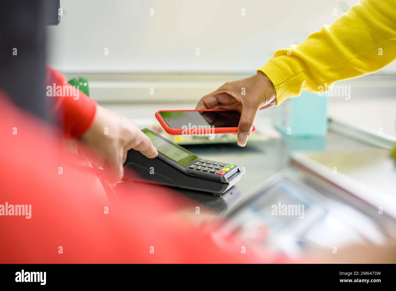 Crop woman using smartphone in office Stock Photo