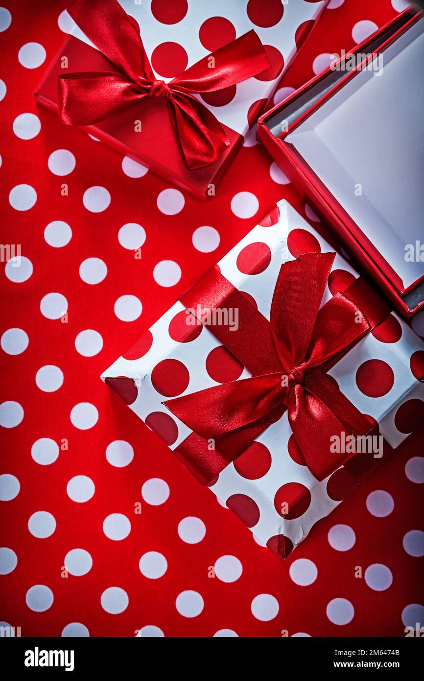 Set of gift boxes on polka-dot red print background celebrations ...