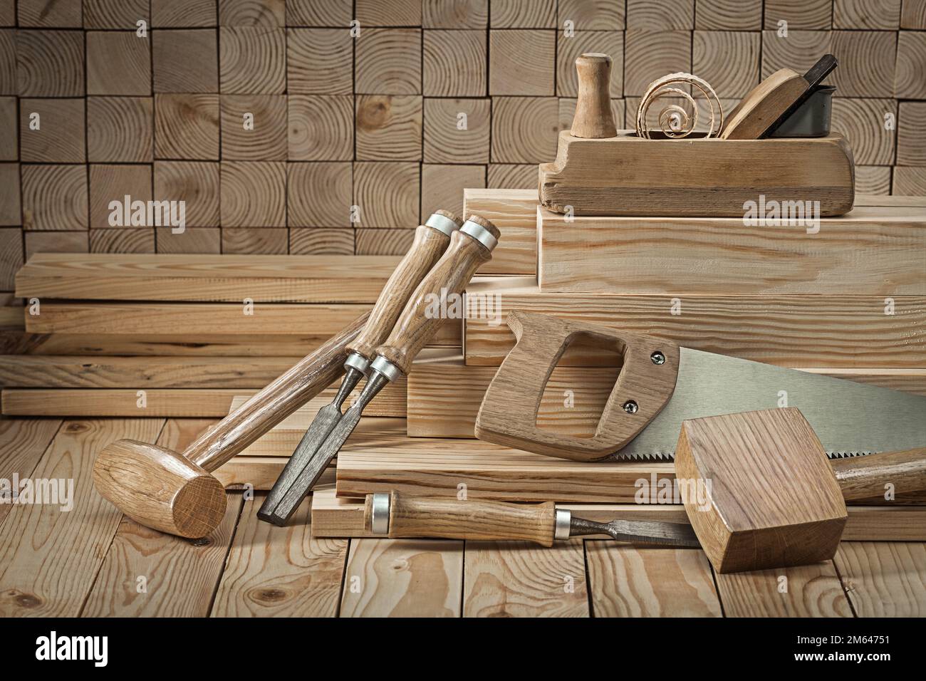 set of carpentry tools wooden mallets chisels woodworking planner on wood background Stock Photo