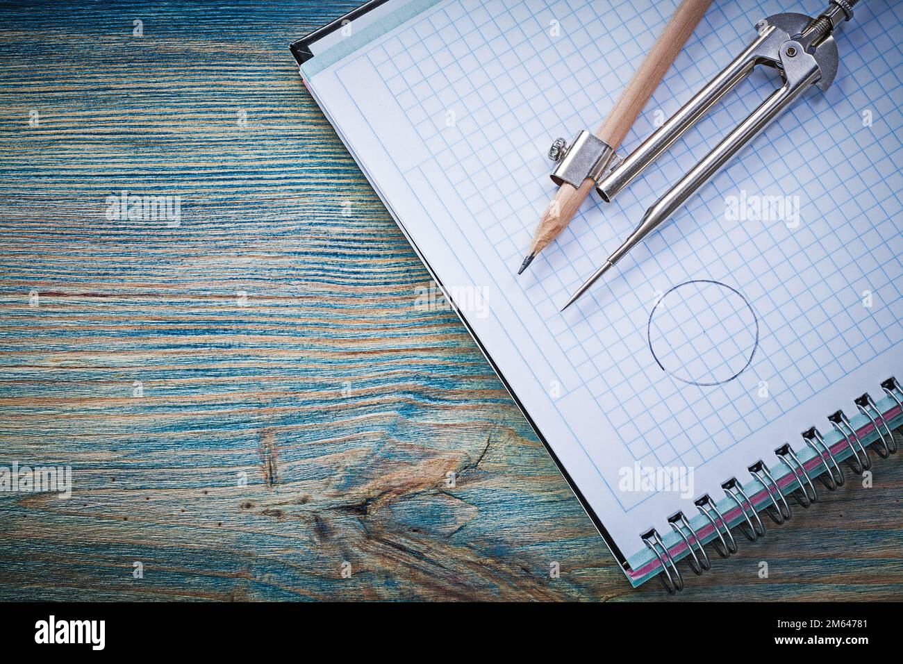 Set of vintage pair of compasses pencil copybook on wooden board construction concept. Stock Photo