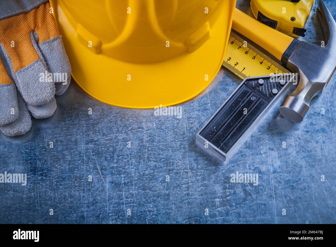 Square ruler safety gloves tape-measure building helmet and claw hammer ...