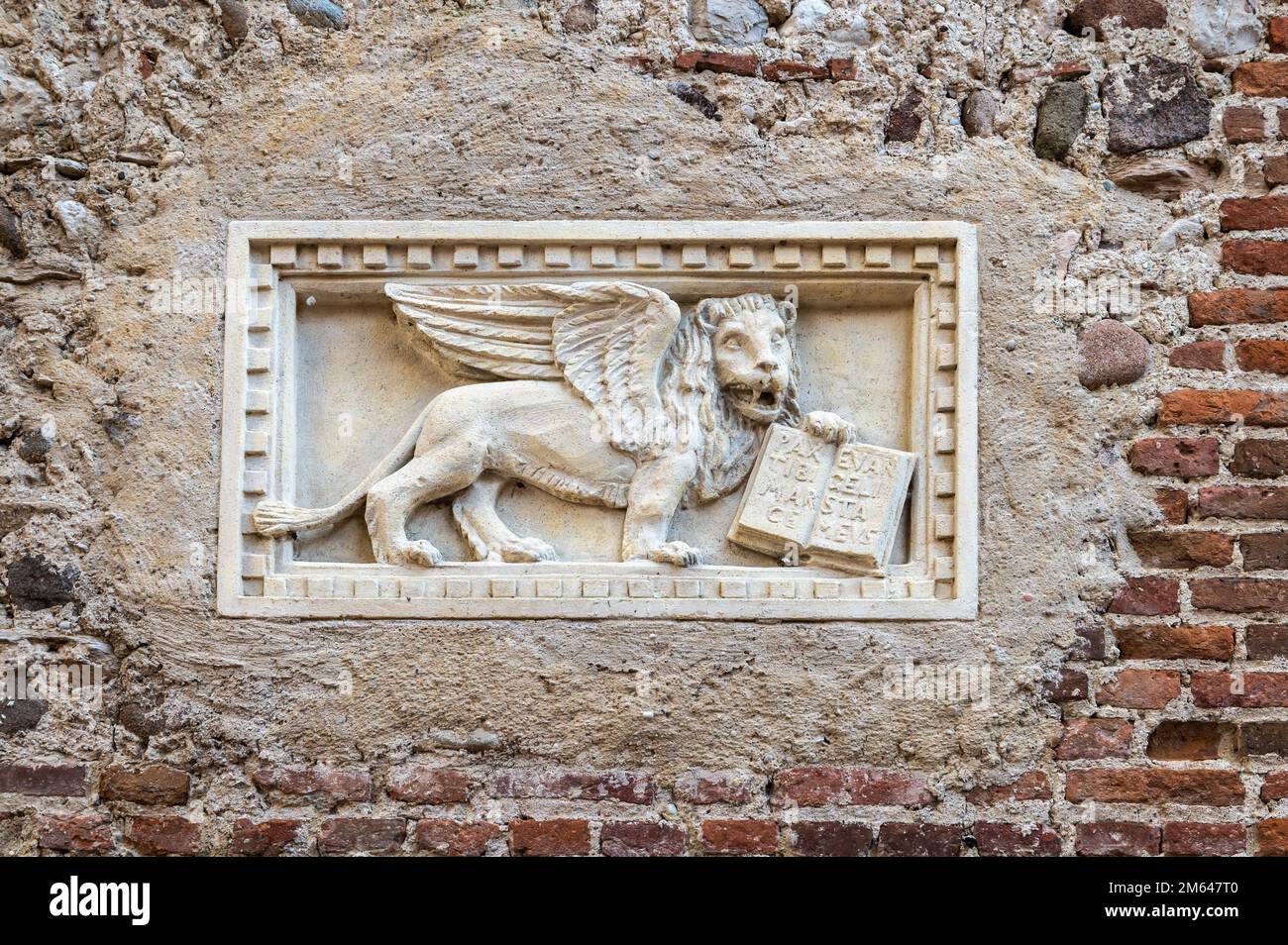 Lion of Saint Mark, symbol of the Serenissima Republic, in the town of Lazise on Lake Garda, Verona province,northern Italy - Europe Stock Photo