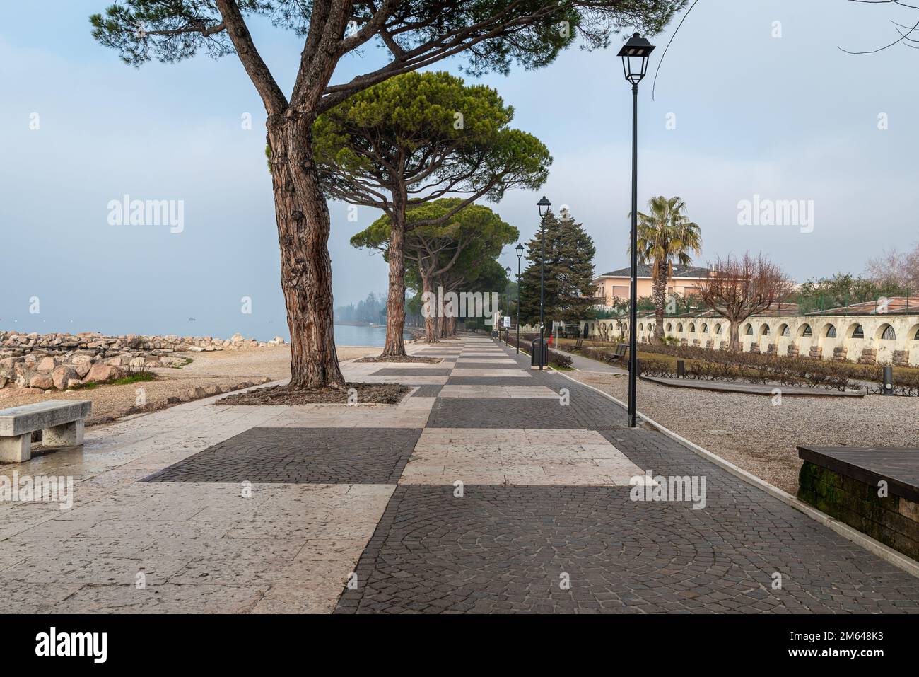 Garda lake  waterfront of the picturesque town of Lazise on Garda lake in the winter season - Verona province, northern Italy, Europe Stock Photo