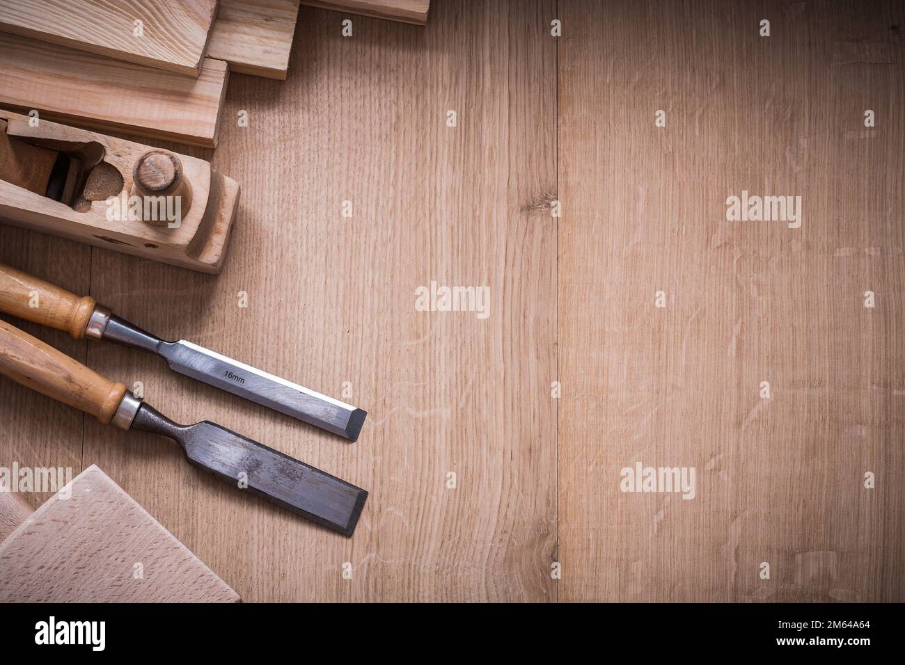 Variation of wooden joiner’s working tools on wood board copy space image construction concept. Stock Photo