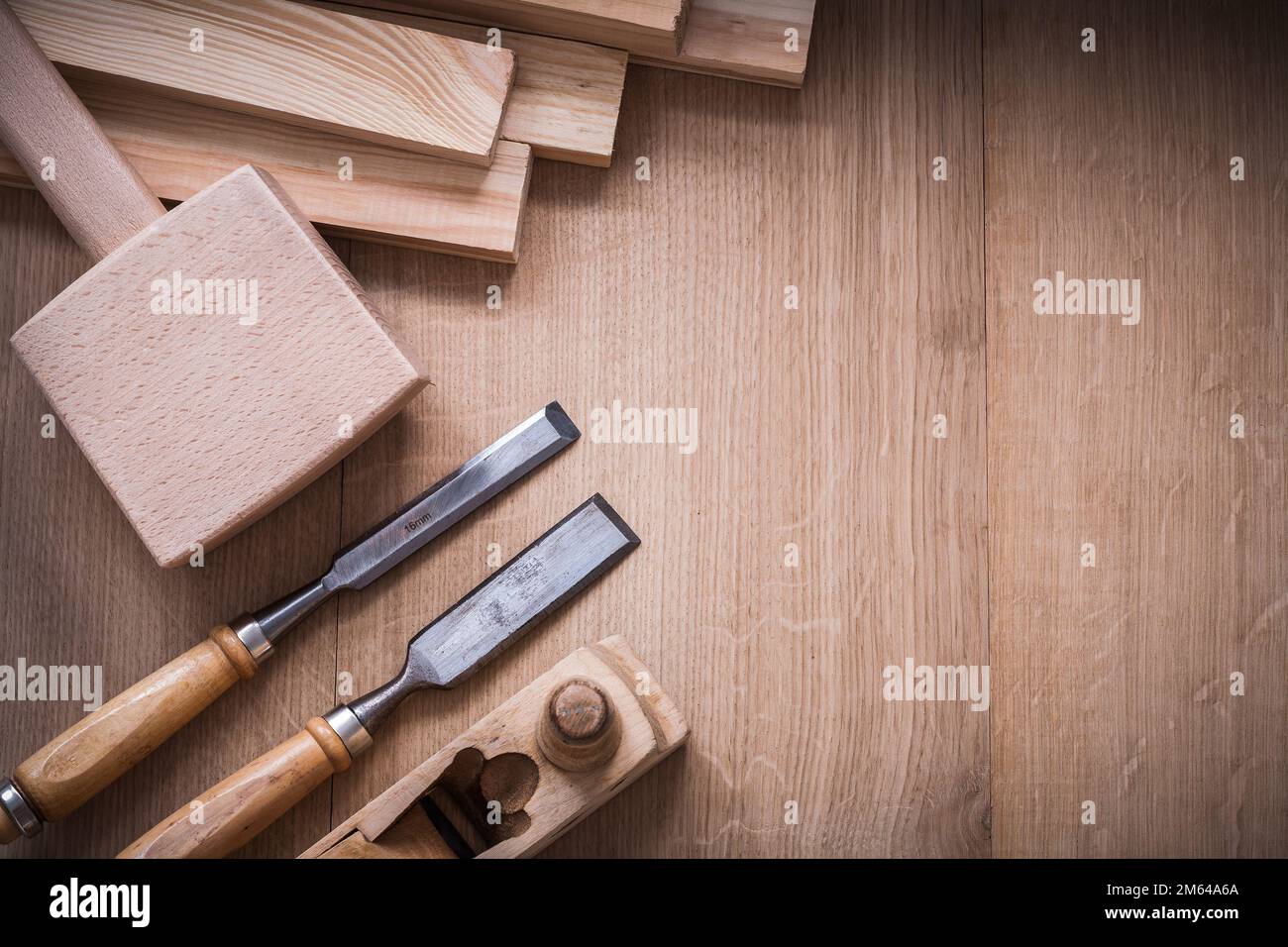 Variation of wooden joiner’s working tools on wood board construction concept. Stock Photo