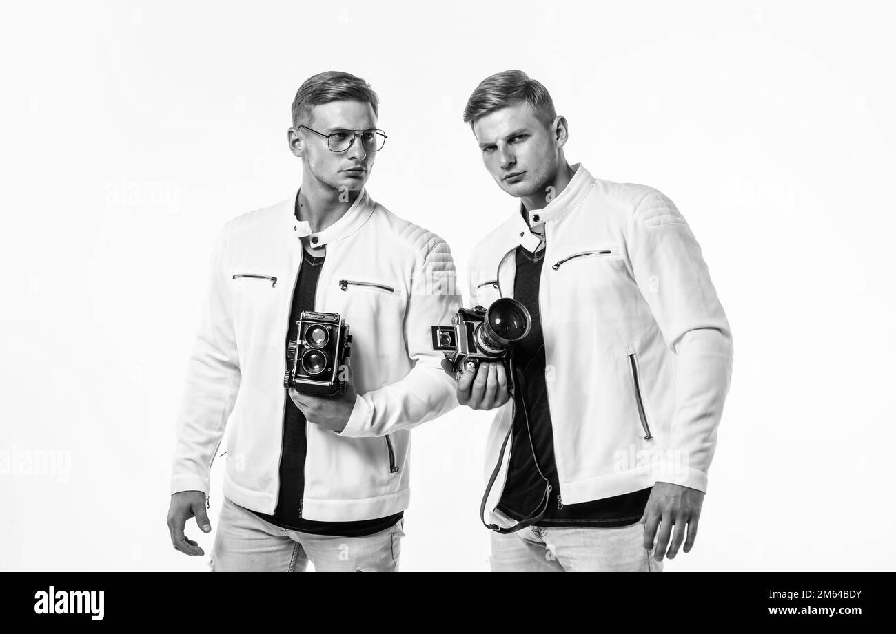 twin brothers men look alike use vintage photo camera, photographing