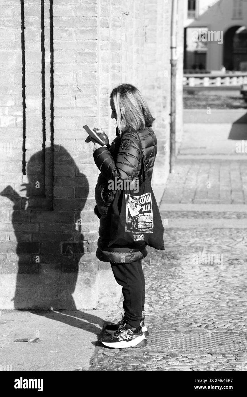 People walking around looking at smartphone Stock Photo