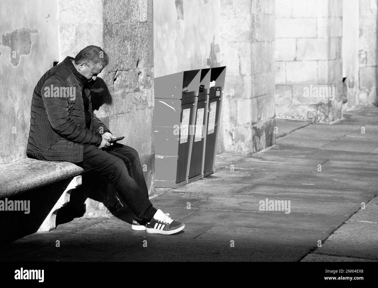 People walking around looking at smartphone Stock Photo