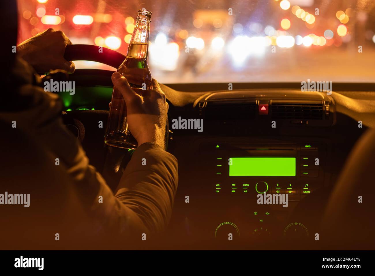 Drinking Beer While Driving Car Man Hold Bottle Alcohol In Hand At The Night Stock Photo Alamy