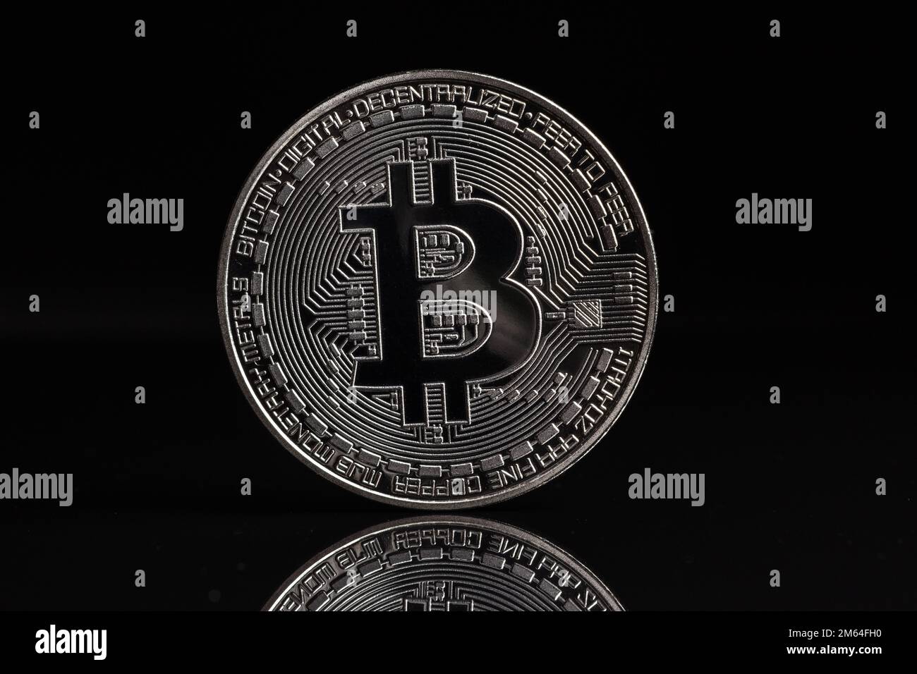 A silver Bitcoin with black background. Bitcoin is a digital cryptocurrency  that can be exchanged for other currencies, products or services Stock  Photo - Alamy