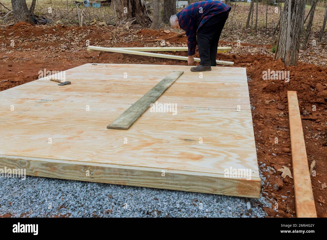 Wood framing beams that make up stick framework of shed deck foundation are made from hardwood Stock Photo