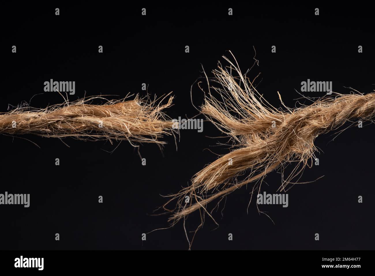 Hanging by a thread - almost broken rope, frayed tensioned cord held  together by a thin string - illustration on white background Stock Photo -  Alamy