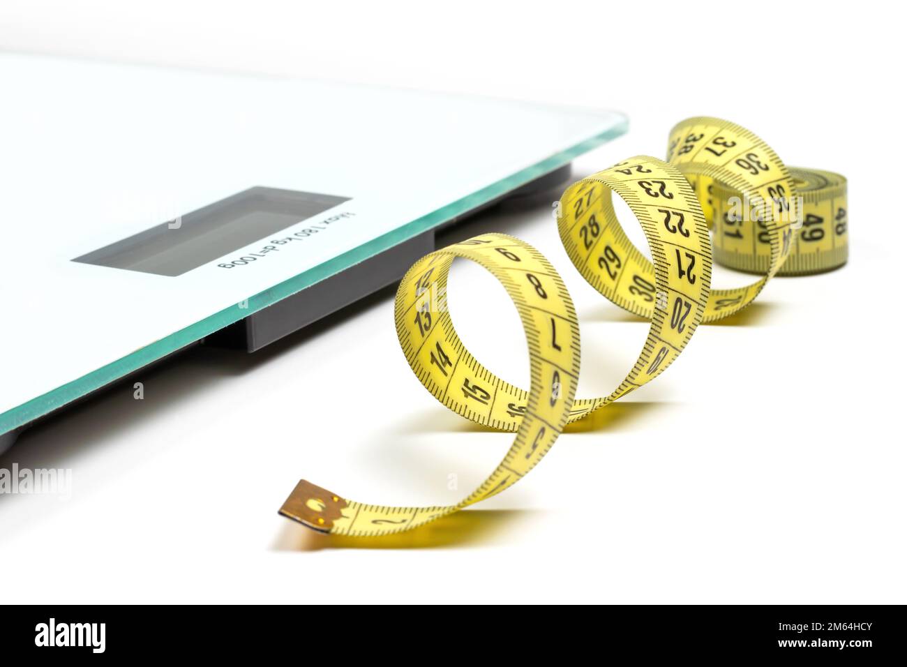 Modern scales and tape measure isolated on white Stock Photo Alamy