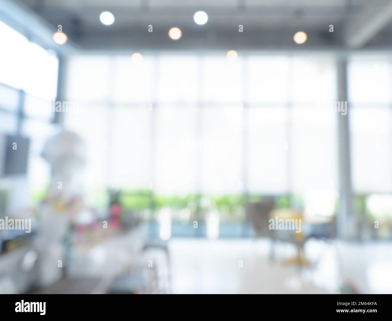 Abstract blurred modern workspace hall background, white indoor interior office or working space with window and the light with space. Blurry backgrou Stock Photo