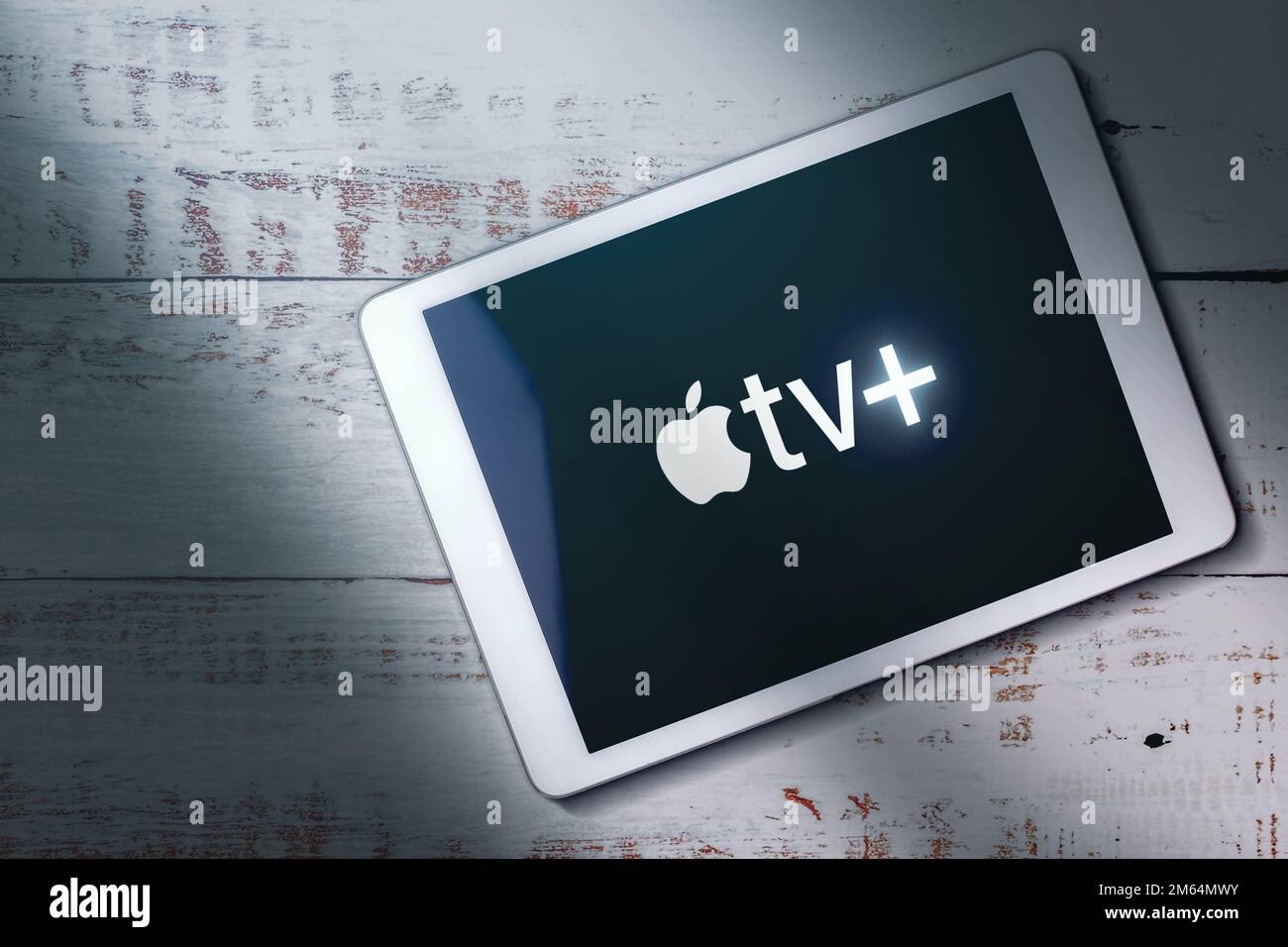 MÁLAGA - SPAIN - DECEMBER 21, 2022: Top view of digital tablet with Apple TV Plus logo on screen. Video streaming subscription service. Stock Photo