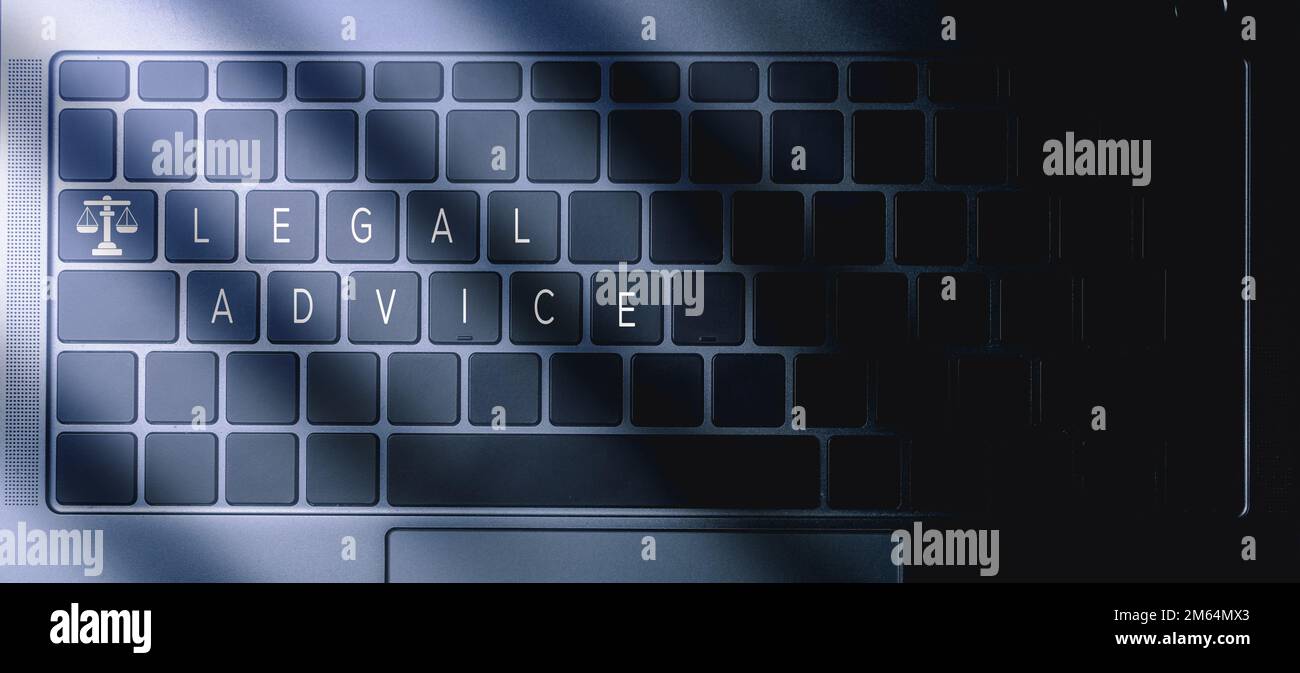 Laptop top view with the words Legal Advice on buttons and justice balance icon. Legal advice technology service concept. Law and defense. Stock Photo