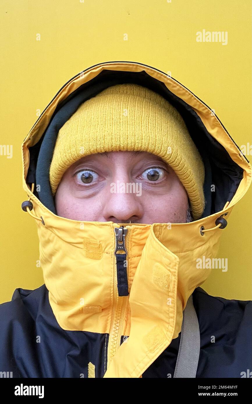 young man in winter jacket Stock Photo