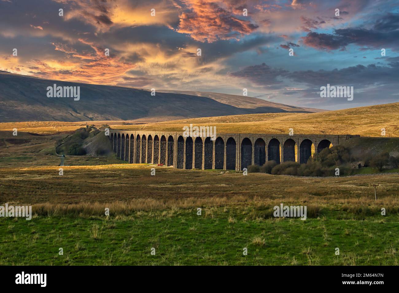 Gorgeous golden light as the sun sets behind the Ribblehead Viaduct Stock Photo