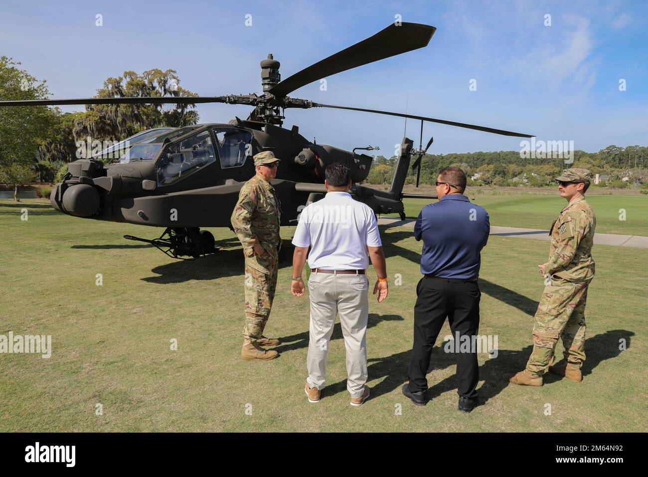 A 3rd Infantry Division Soldier describes the role of the AH-64E Apache at the Deer Creek Course at The Landings Club, Savannah, Georgia, April 2, 2022. The static vehicle display was a part of Military Appreciation Day, held on the second to last day of the Club Car Championship. Stock Photo