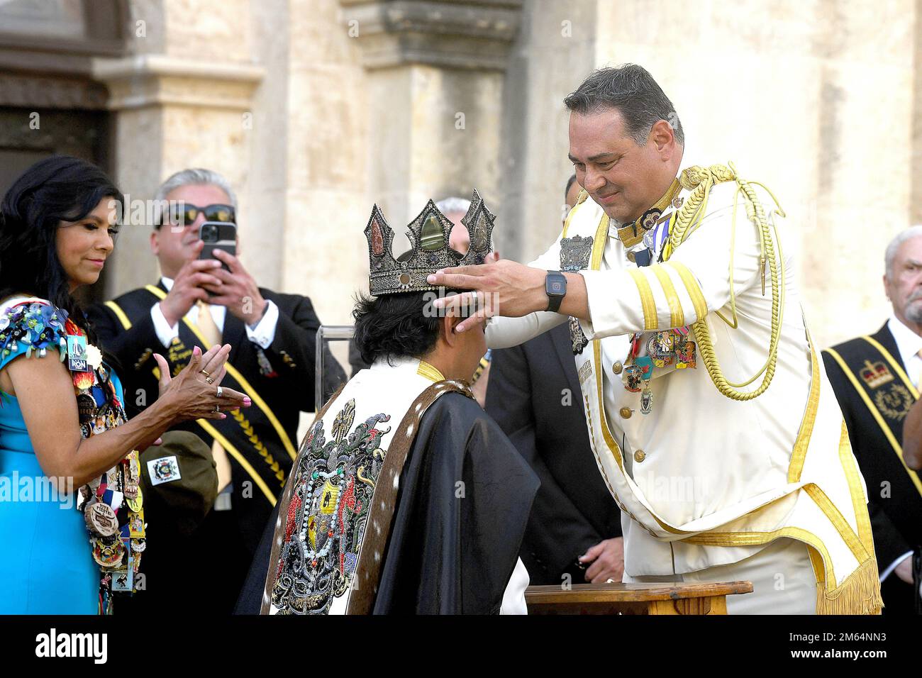 The 2021 El Rey Feo, Thomas Aguillon, crowns Augie Cortez as the 2022 El Rey Feo, King Antonio