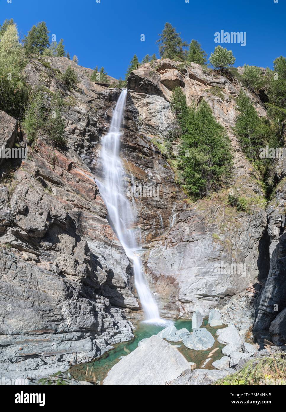 Mountain alpine Lillaz waterfall (Cascate di Lillaz) rush down granite ...