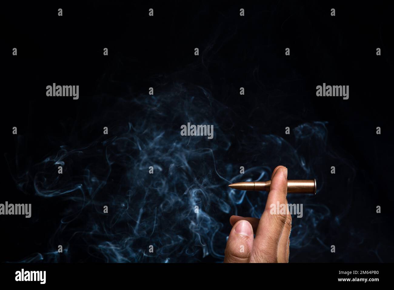 Smoking is harmful. Instead of a cigarette, he is holding a cartridge