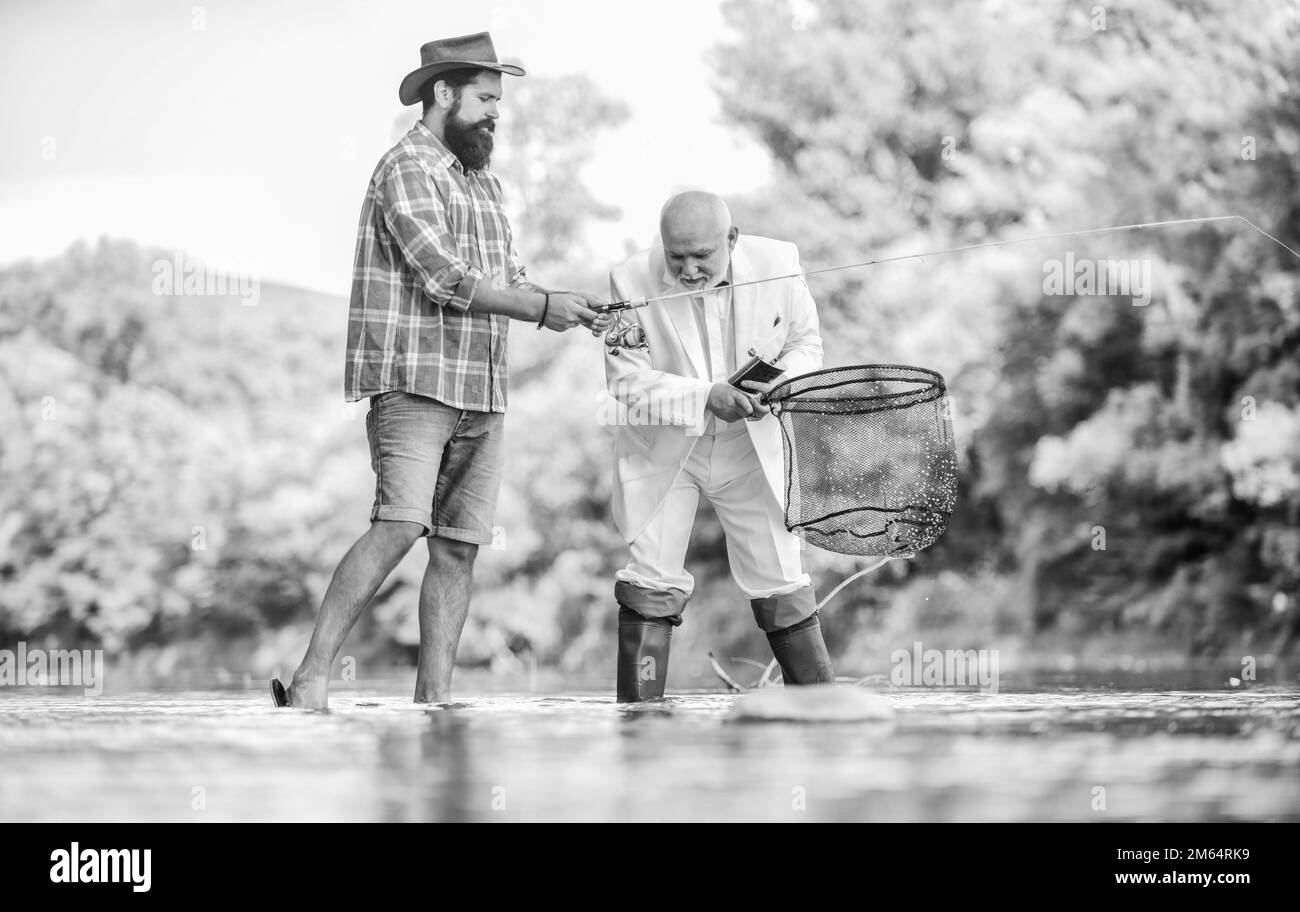 new skills. hobby and recreation. Success. Fishermen. successful catch. fisher celebrate retirement. good production. retired businessman. male Stock Photo