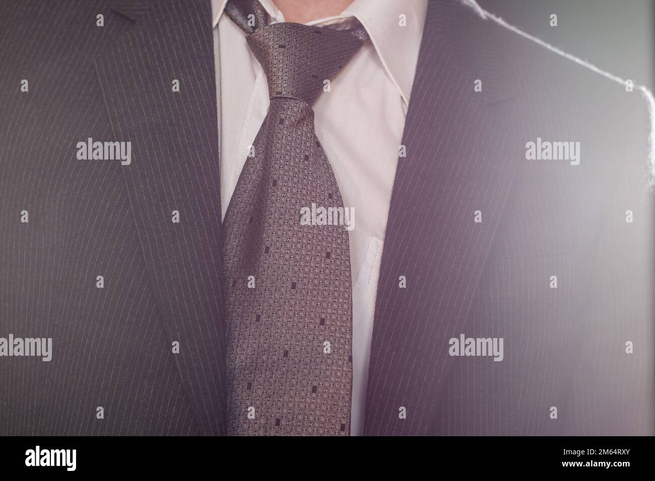 Dark gray suit and tie on the businessman Stock Photo Alamy