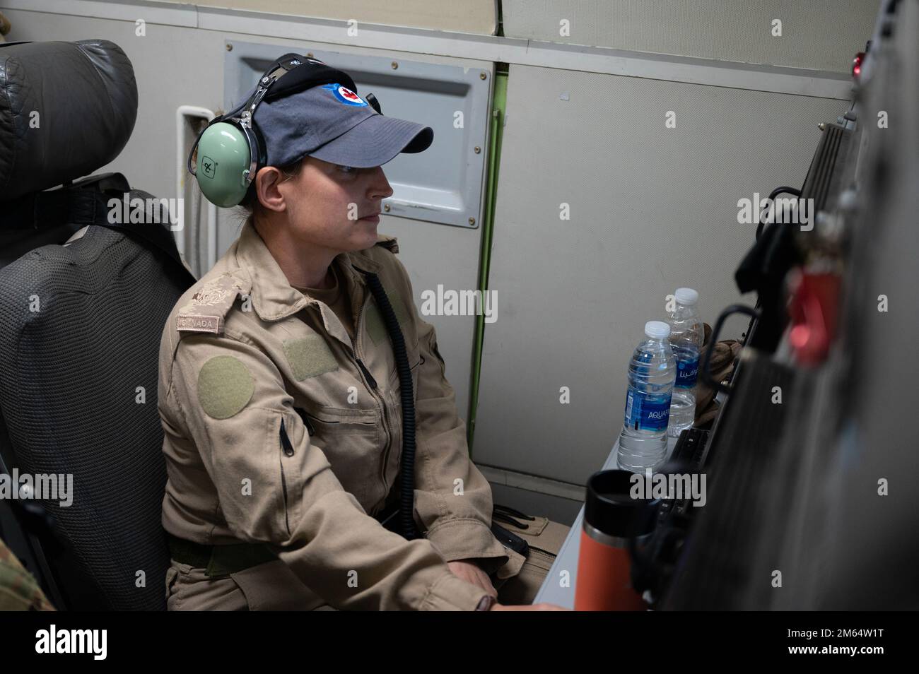 A Royal Canadian Air Force datalink operator assigned to the 968th Expeditionary Airborne Air Control Squadron conducts operations on a U.S. Air Force E-3G Sentry above the U.S. Central Command area of responsibility, April 1, 2022. The E-3 Sentry is an airborne warning and control system (AWACS) aircraft with an integrated battle management command and control (BMC2), surveillance, target detection, and tracking platform. Stock Photo