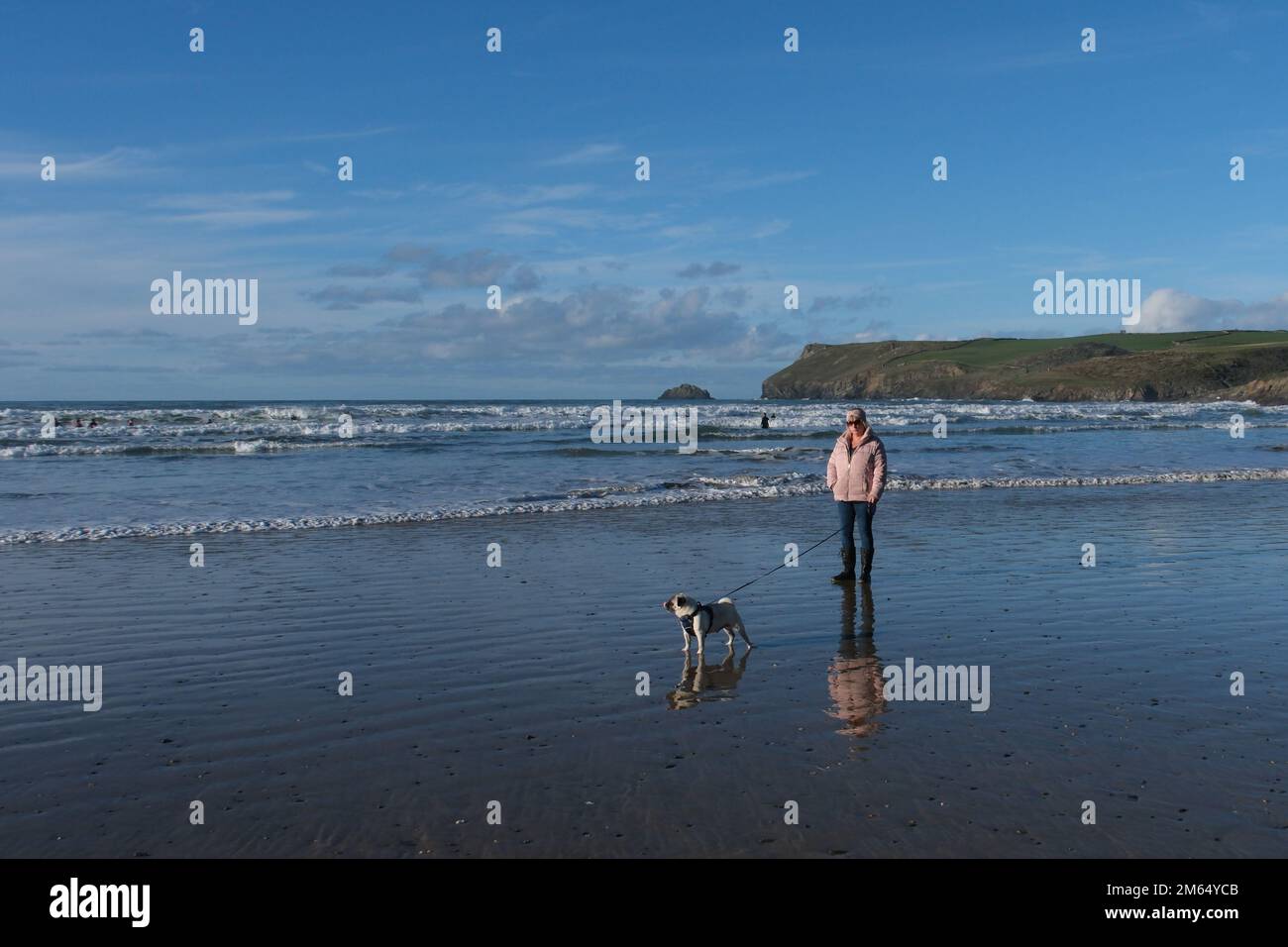 Polzeath, Cornwall, UK. 2nd January 2023. People making the most of the fine bank holiday weather today, with heavy rain and strong winds forecast for the return to work from tuesday. Credit Simon Maycock / Alamy Live News. Stock Photo