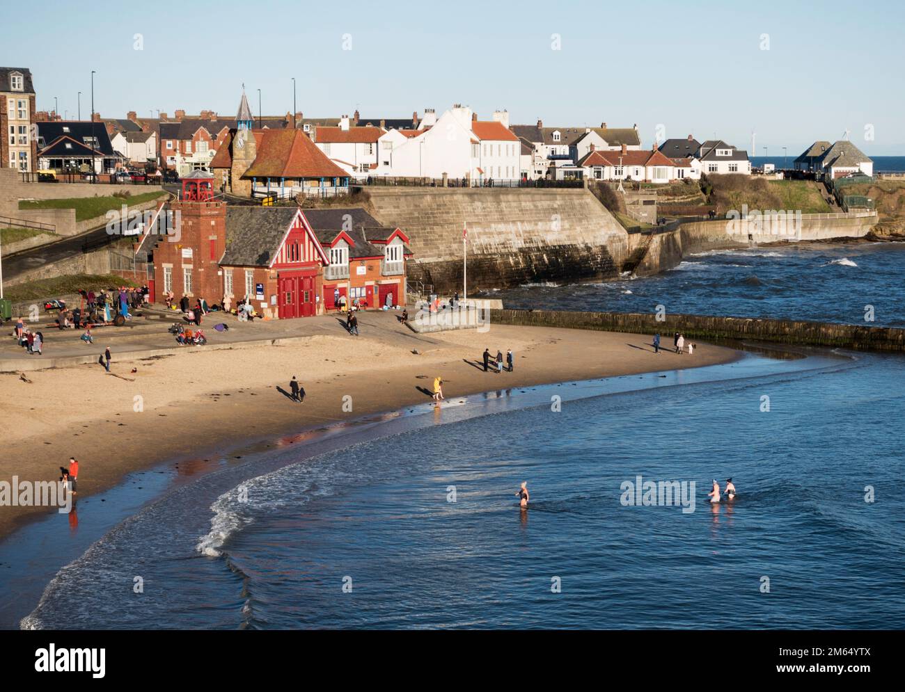 Cullercoats 2-1-2023 People swimming in the sea January,  Cullercoats Bay, north east England, UK Stock Photo