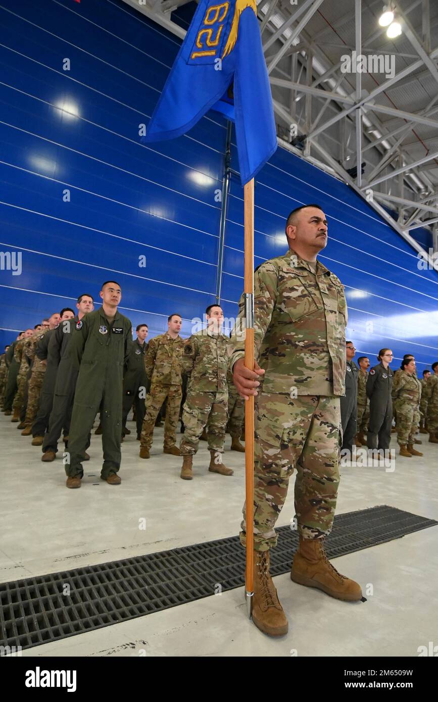 Airmen from the 129th Rescue Wing, California Air National Guard, stand in formation during the wing’s Change of Command ceremony, April 2, 2022, at Moffett Air National Guard Base, California. During the ceremony, outgoing commander U.S. Air Force Col. Jeffrey Waldman relinquished command to incoming commander, Col. Victor Teal, Jr. At center is Master Sgt. Miguel Hernandez, who serves as first sergeant with the 129th Logistics Readiness Squadron. Stock Photo