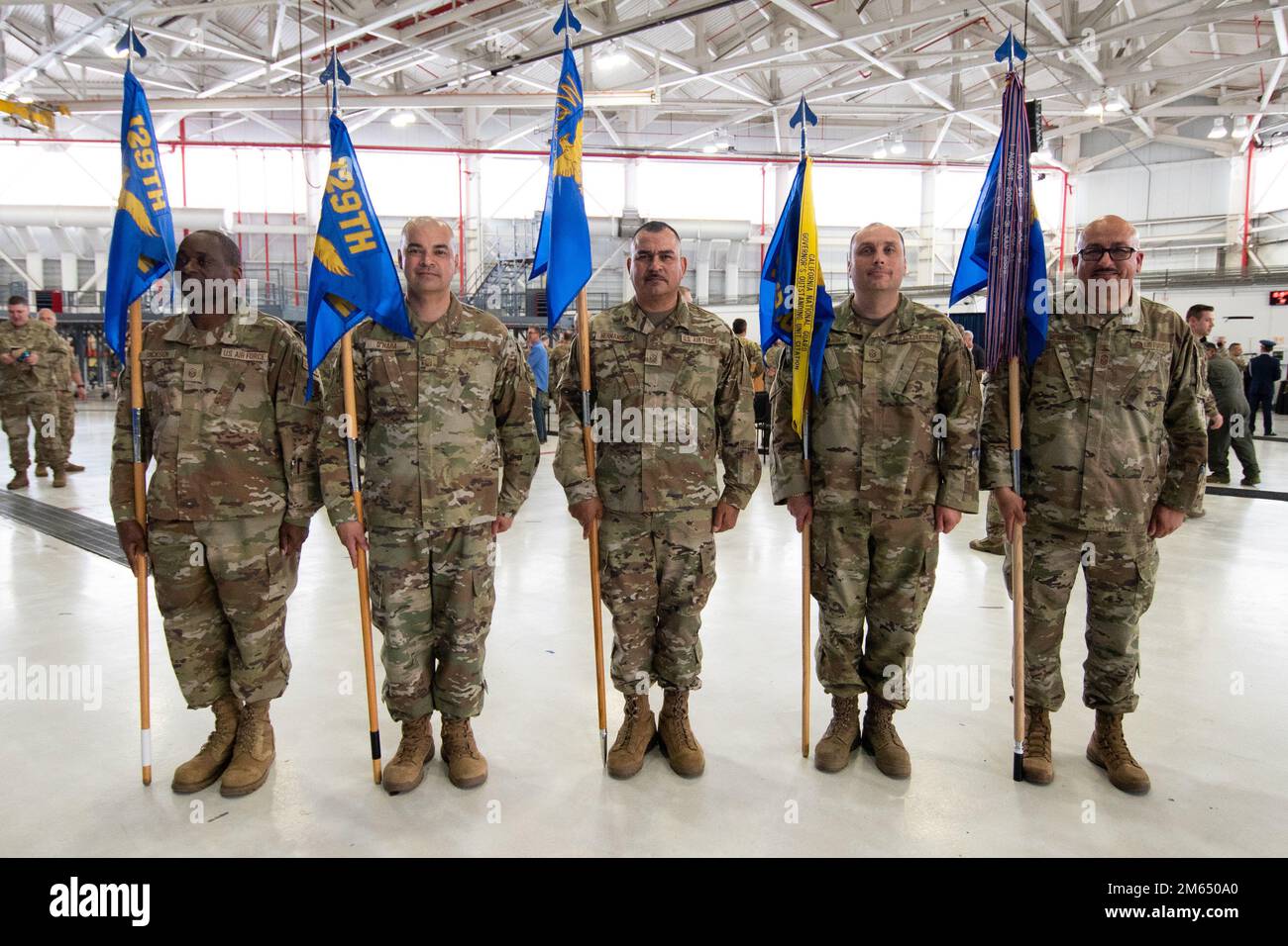 First sergeants from the 129th Rescue Wing, California Air National Guard, gather for a group photo after the wing’s Change of Command ceremony, April 2, 2022, at Moffett Air National Guard Base, California. From left: U.S. Air Force Master Sgt. Stanford Dickson, Master Sgt. Patrick O’Hara, Master Sgt. Miguel Hernandez, Master Sgt. Octavio Bugarin and Senior Master Sgt. Jose Mercado. Stock Photo