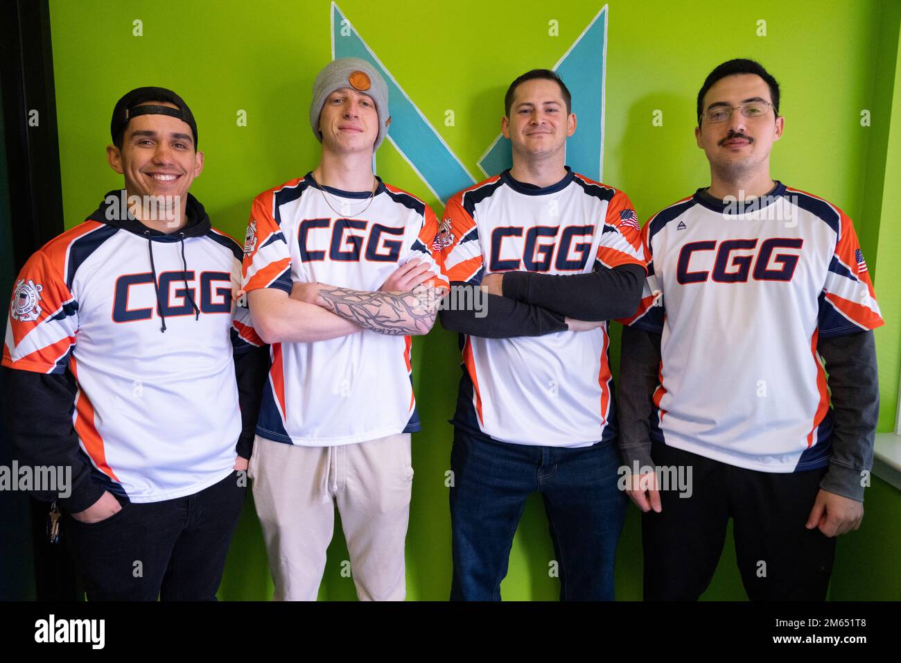 Petty Officer 2nd Class Claudio Giugliano, Petty Officer 3rd Class Reece Womick, Petty Officer 1st Class Alex Alfonso and Petty Officer 1st Class Micahel Lopez, members of the US Coast Guard Rocket League Team, pose for a team photo at Metro Esports in Warminster, Pennsylvania, April 2, 2022. The team competed in the first Coast Guard-sponsored esports event, held by Philly Esports and Metro Gaming. Stock Photo