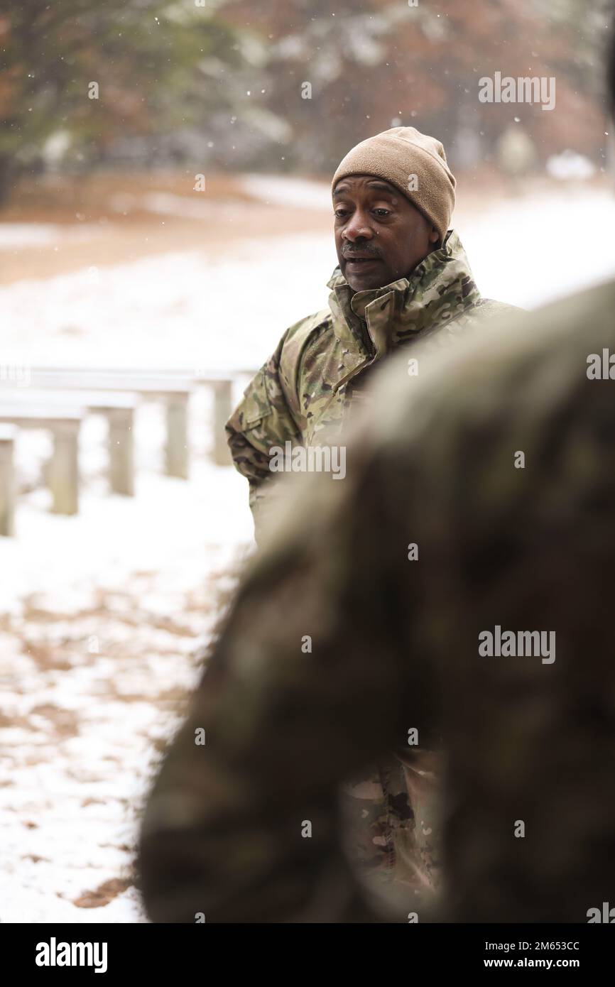 Maj. Gen. Jonathan Woodson, Army Reserve Medical Command Commanding General, speaks to competitors in AR-MEDCOM's 2022 Best Warrior event at Fort McCoy, Wis., as they await competing in an obstacle course on April 2, 2022. Stock Photo