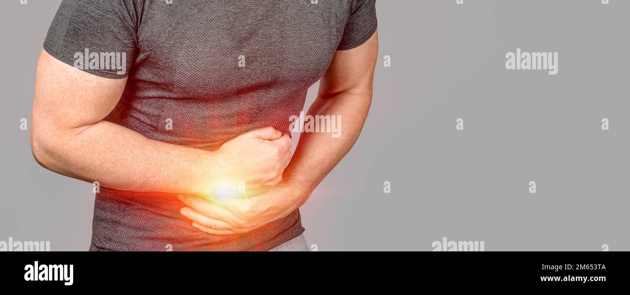 Abdominal Pain. Unhealthy man suffering with stomach pain. Intestinal inflammation. Abdominal pain man, large intestine on man body, stomachache diarr Stock Photo