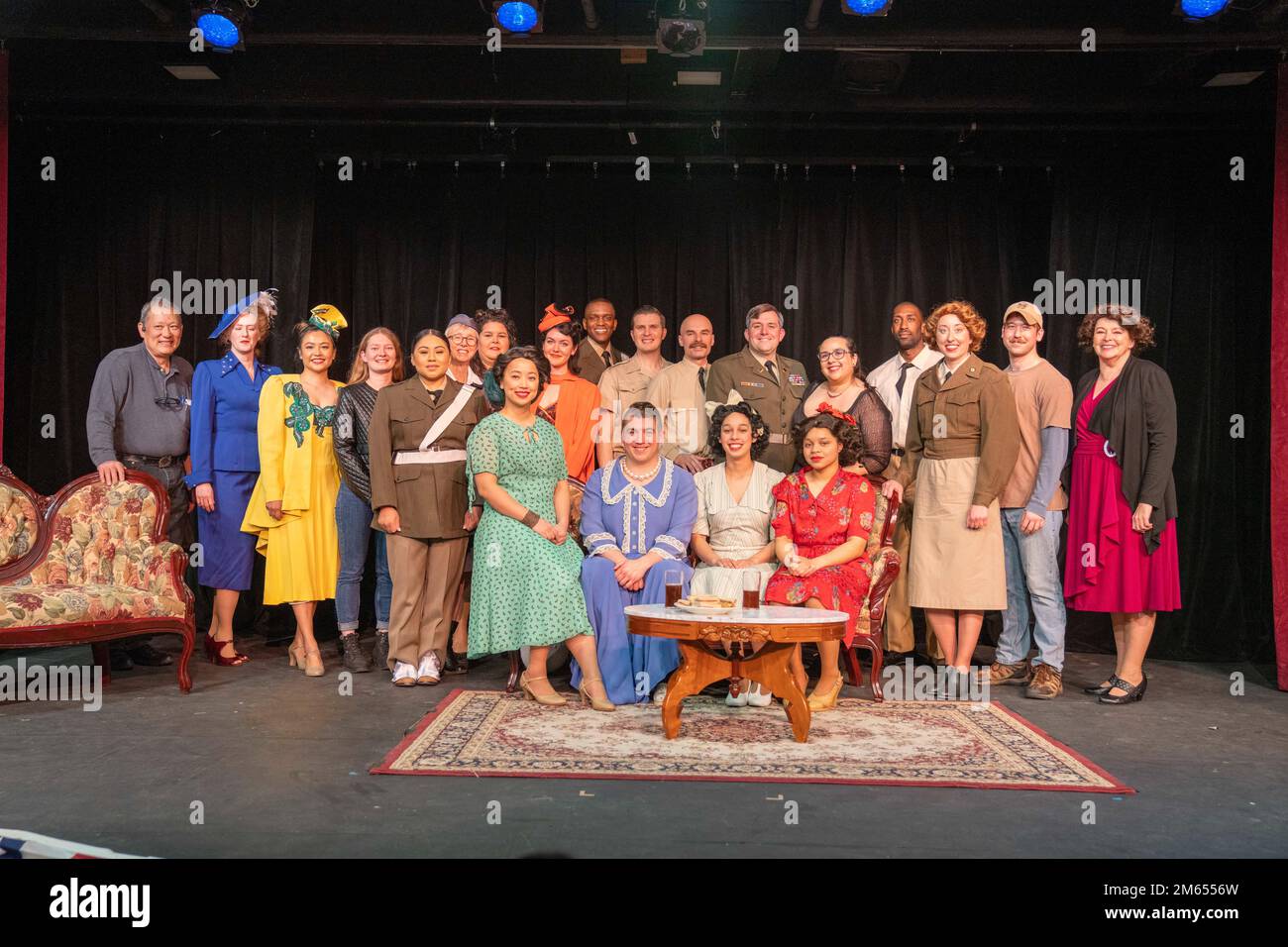 ANSBACH, Germany – The cast and crew of “Ten-Hut! An All Soldier Show” poses for a quick photo, April 2. Soldiers performed 3 acts during the play, which included one-act plays consisting of “The Strange Case of Private Piddle”, “Sally, Irene, and Grandma” (both produced by Special Services Division A.S.F.,1945), and “Love Letters”. For the first time since 2001, the Base Support Battalion, United States Army Garrison Ansbach, hosted the all-Soldier show, which was originally written in 1945, at the Terrace Playhouse, Bleidorn Kaserne. Stock Photo
