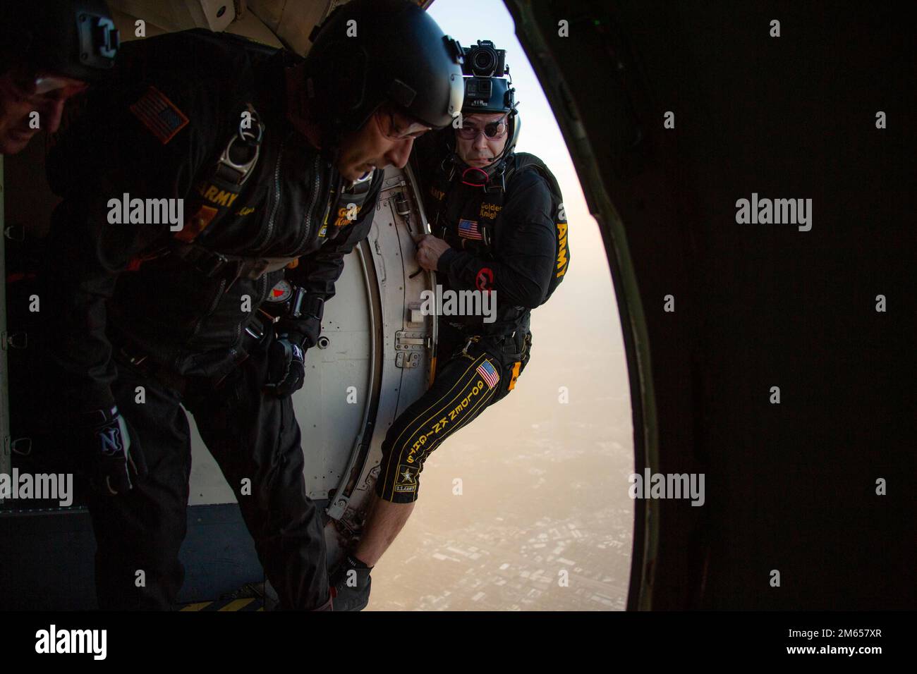 Parachutists from the U.S. Army Parachute team, the Golden Knights, prepare to jump into the San Antonio Country Club in San Antonio, Texas, April 3, 2022. The Golden Knights are one of the three of the Department of Defense’s aerial demonstration teams, alongside the U.S Navy Blue Angels and the U.S. Air Force Thunderbirds. Stock Photo