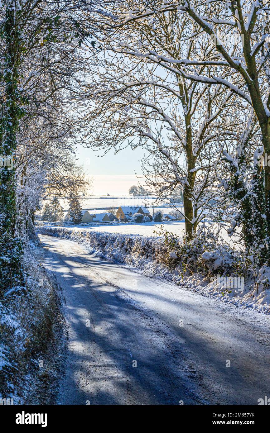 Early winter snow on a lane near the Cotswold village of Birdlip, Gloucestershire, England UK Stock Photo