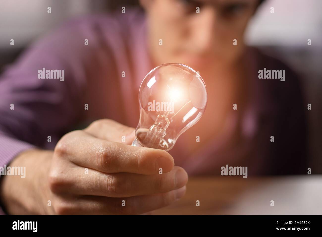 Man holding light bulb in hand. idea concept with innovation and ...