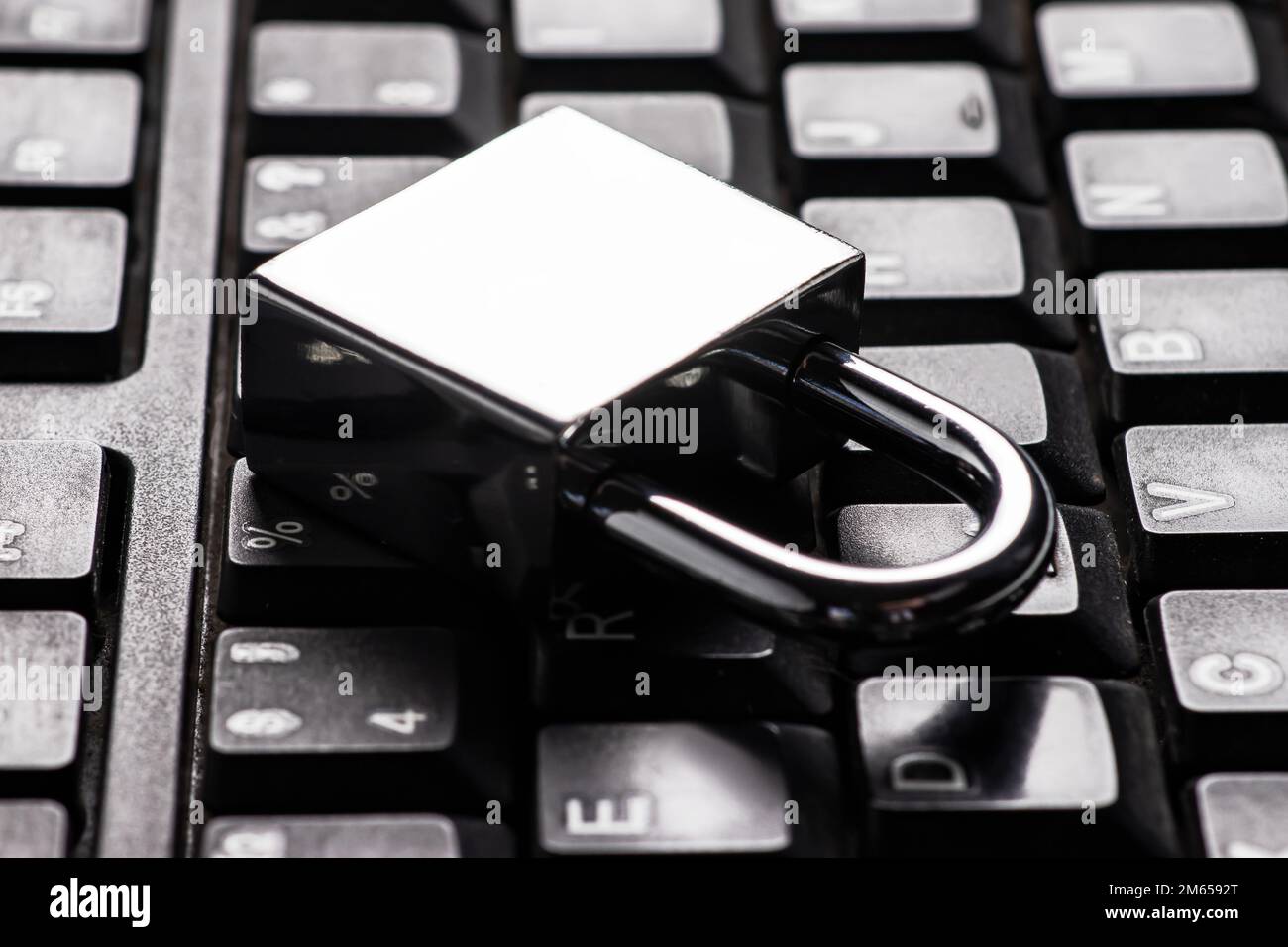 Computer security concept with a closed padlock on the keyboard. Stock Photo