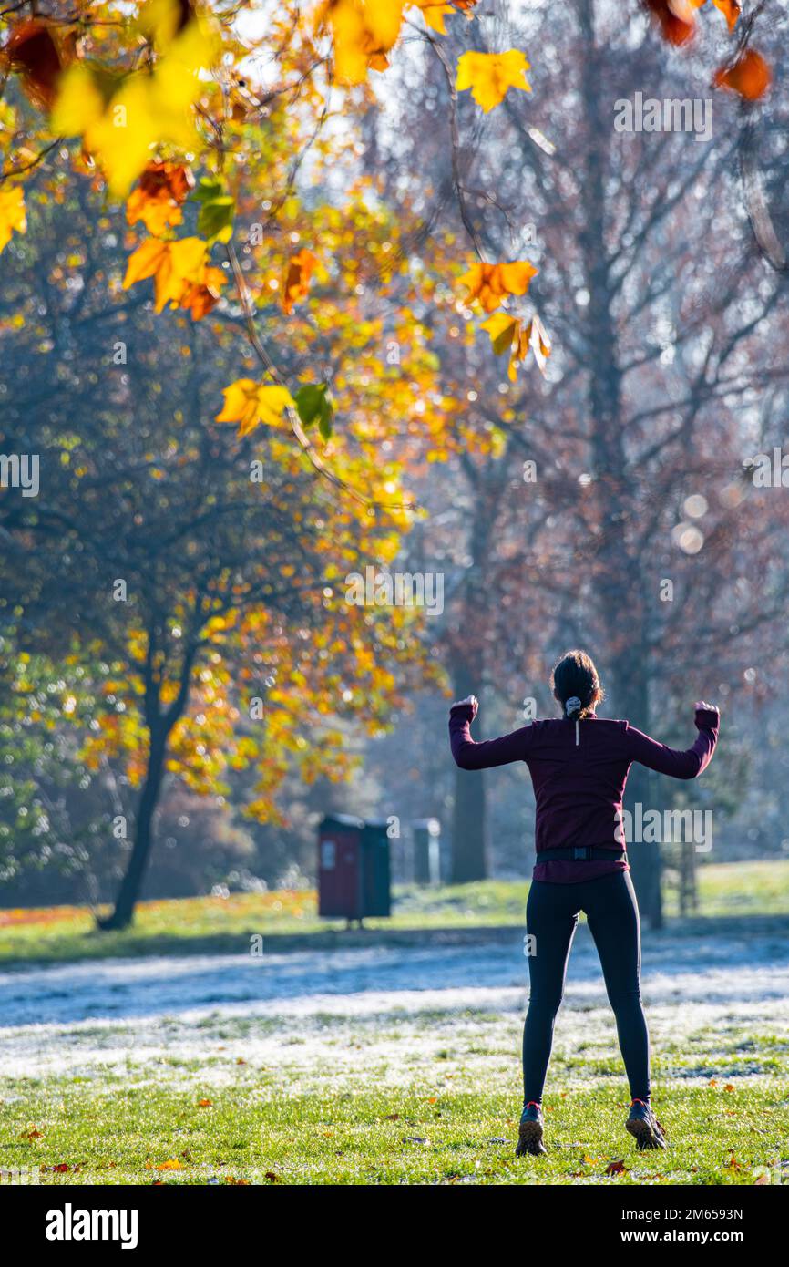 A woman keeps fit in on a sunny day in the middle of winter Stock Photo