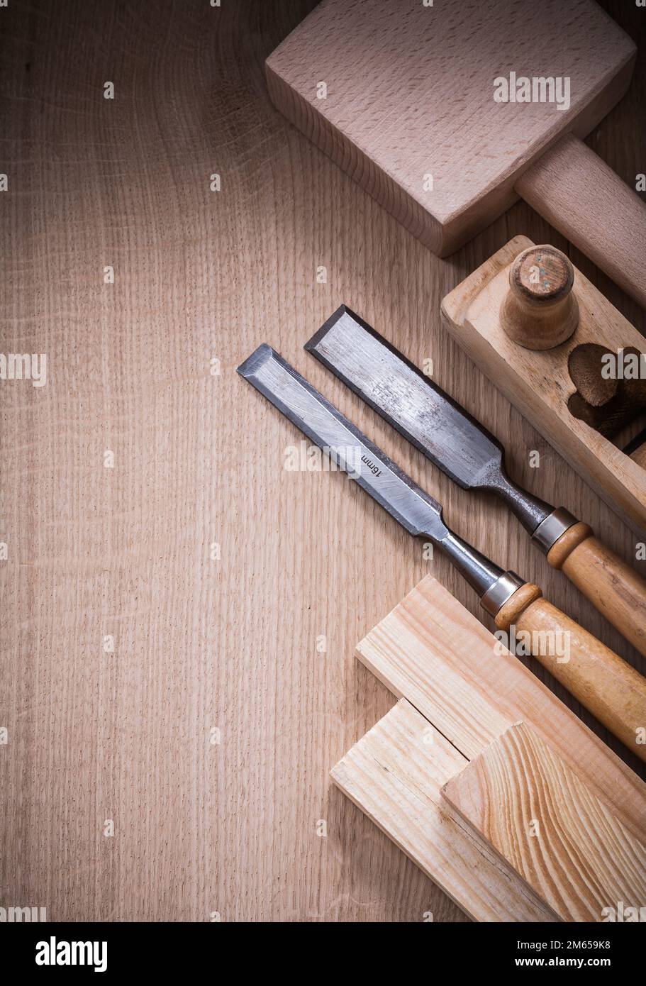 Collection of wooden carpenter’s tools on wood board construction concept. Stock Photo