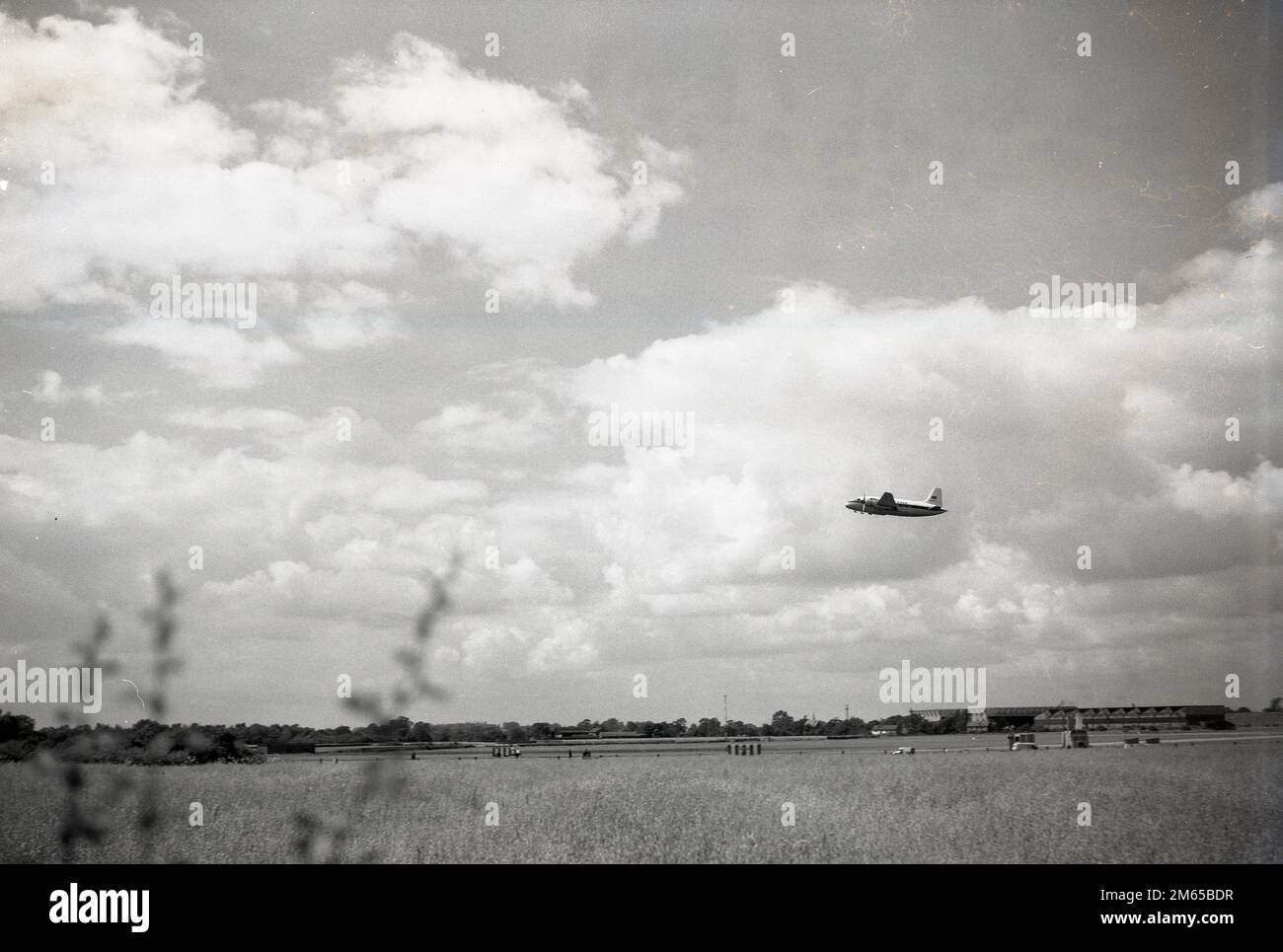 1950s, historical, Capital Aiways single propellered aircraft in flight at Ringway Airport