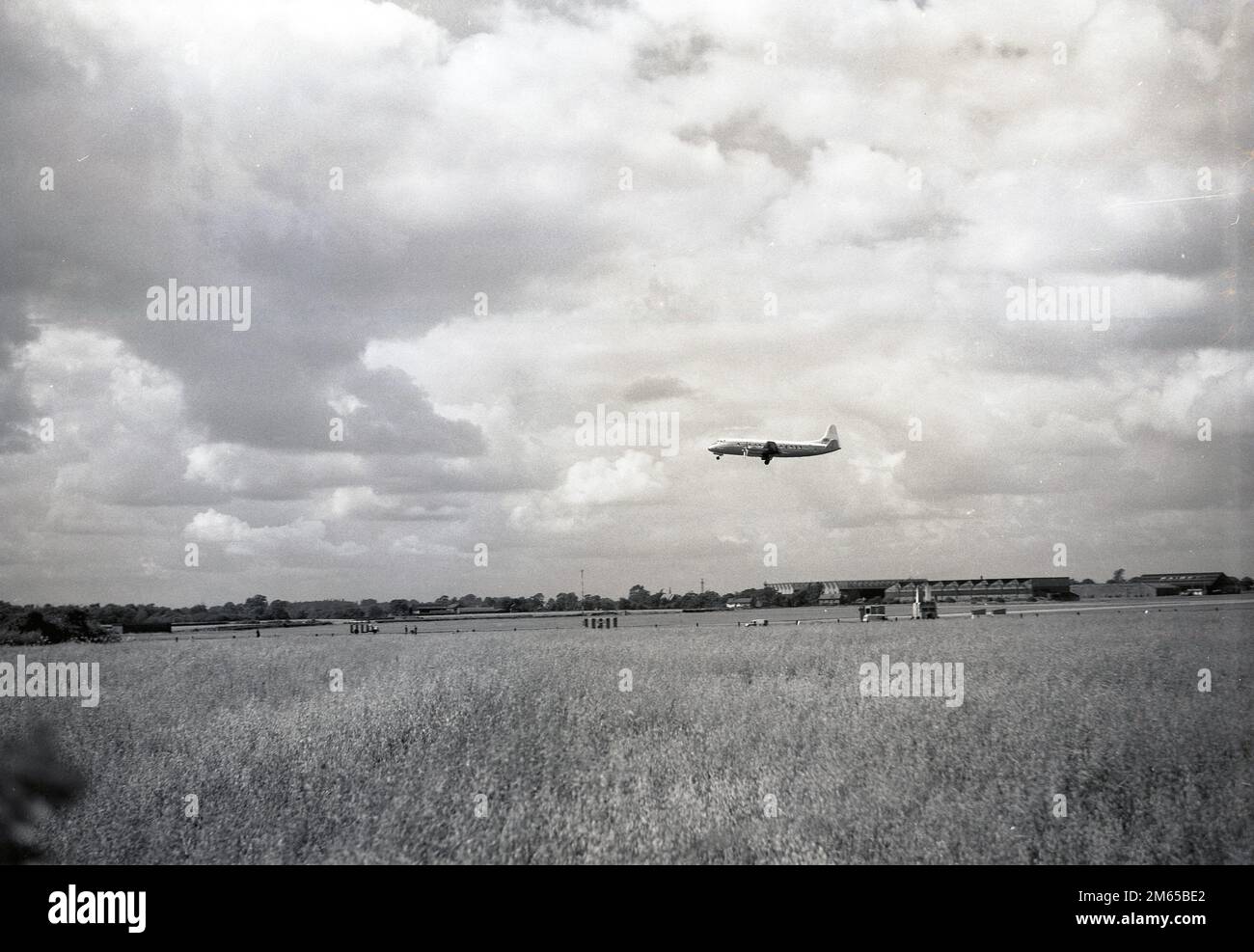 1950s, historical, twin propellered aircraft in flight at Ringway Airport, Southport, England